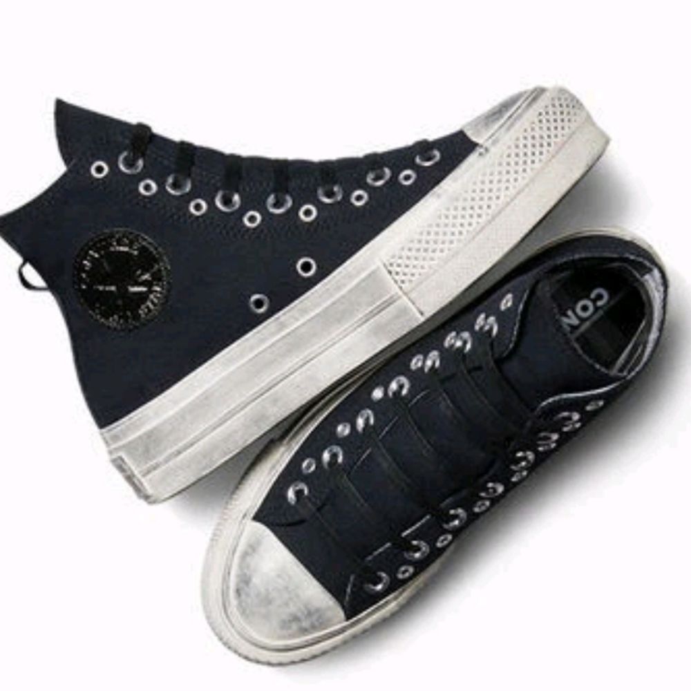 Converse High Top Sneakers in Black and White